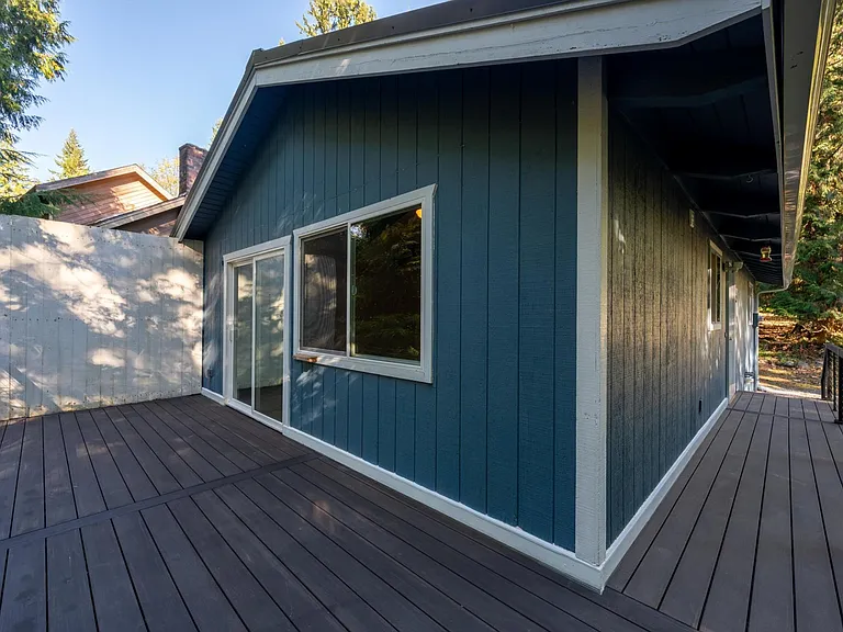 Brand new composite deck & metal railing is easy to keep clean. Privacy wall to keep private from neighbors