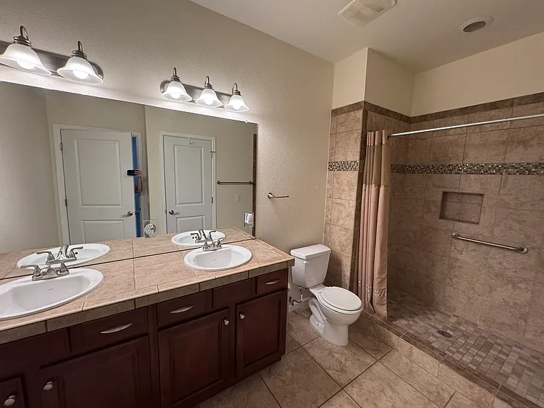 Master Bathroom, includes two sinks and a walk-in shower
