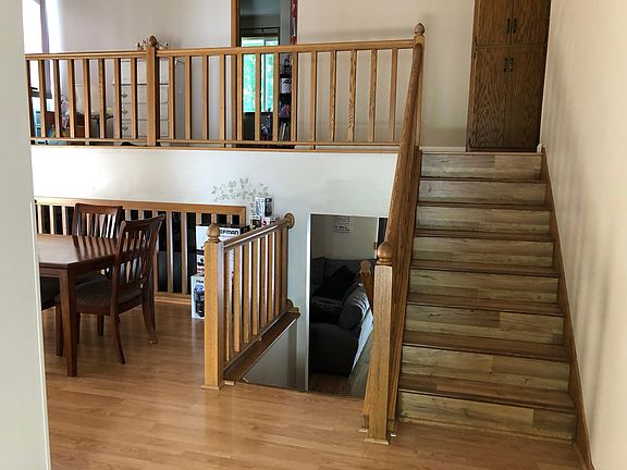 left is the dinning area. upstairs to 3 bedrooms. down stairs to family room, 4th bedroom and office