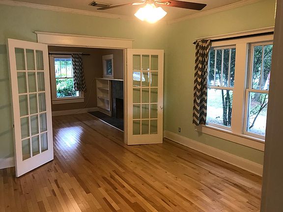 Living Room with French Doors to Dining Room/Den; Ceiling Fan with Dimmable Light
(photo from kitchen doorway facing towards front of house)