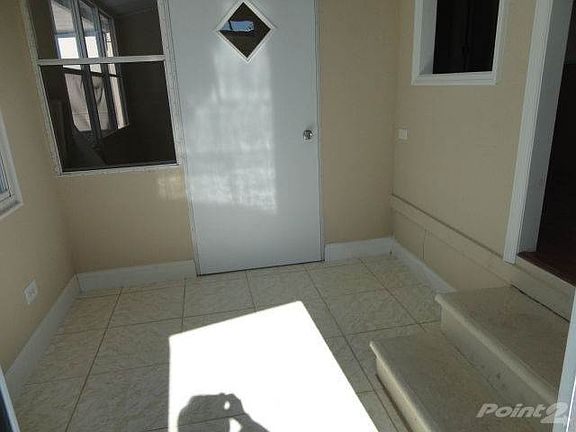 Foyer has new tile flooring