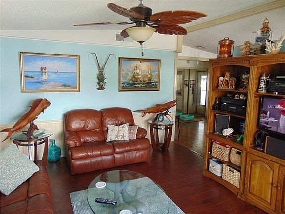 Living room towards dining and kitchen