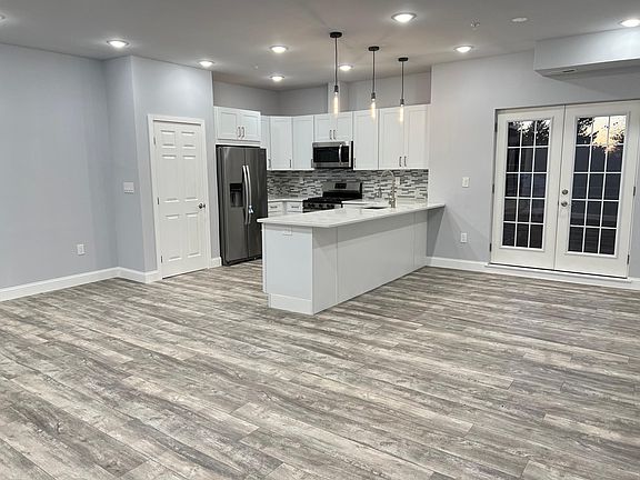Kitchen, Dining, Living Area and Full Balcony