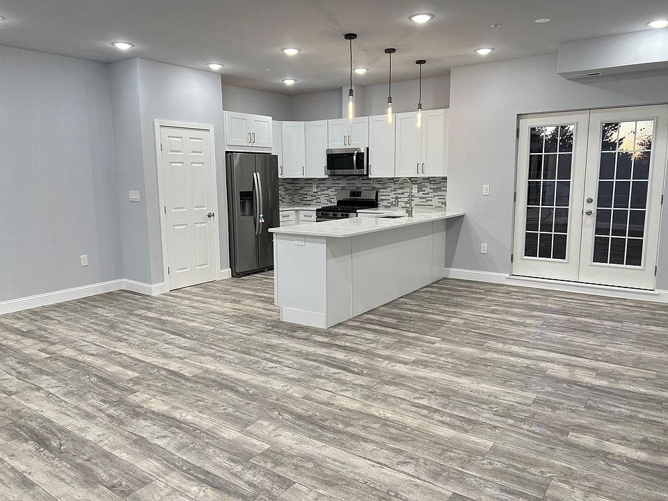 Kitchen, Dining, Living Area and Full Balcony