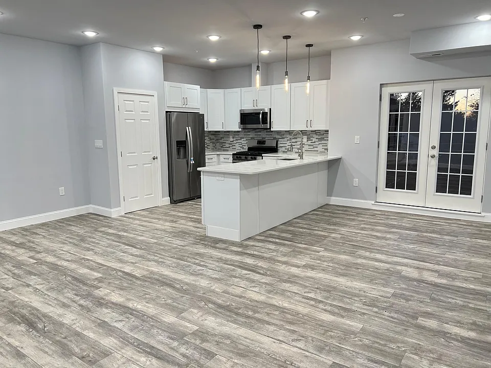 Kitchen, Dining, Living Area and Full Balcony