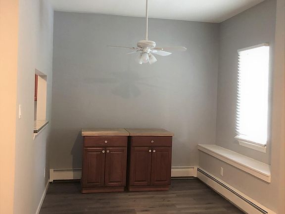 To Left of Front Door is DR w/Opening to Kitchen & Window Seat