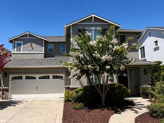 Inviting front exterior with two-car attached garage