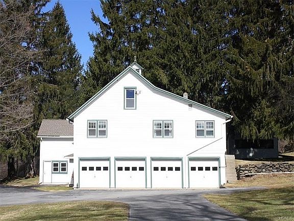 5 car garage with 2 bedroom caretaker's cottage above.