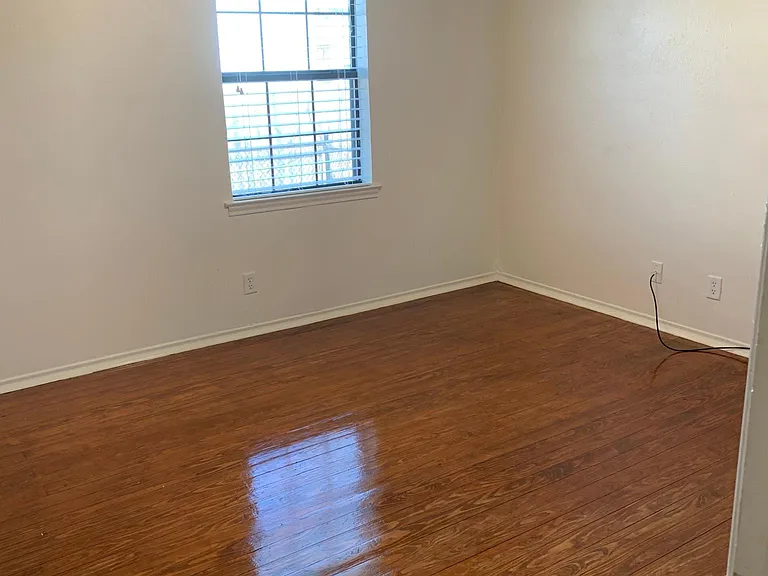 Back corner bedroom. with ceiling fan.