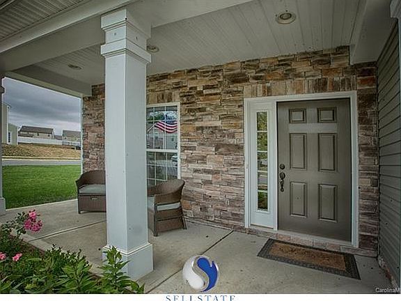 Beautiful Stone back drop, deep porch...