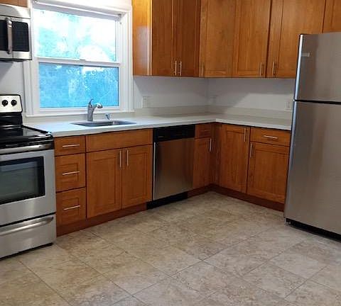 Spacious eat-in kitchen. Can accommodate small kitchen table and chairs.