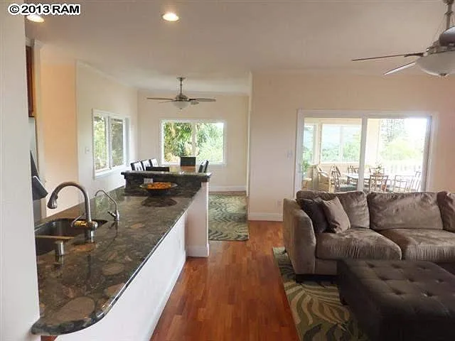 Furnished example of great room (kitchen, dining, living, lanai)