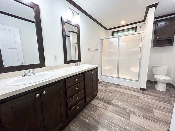 Brown Finishes Primary Bathroo