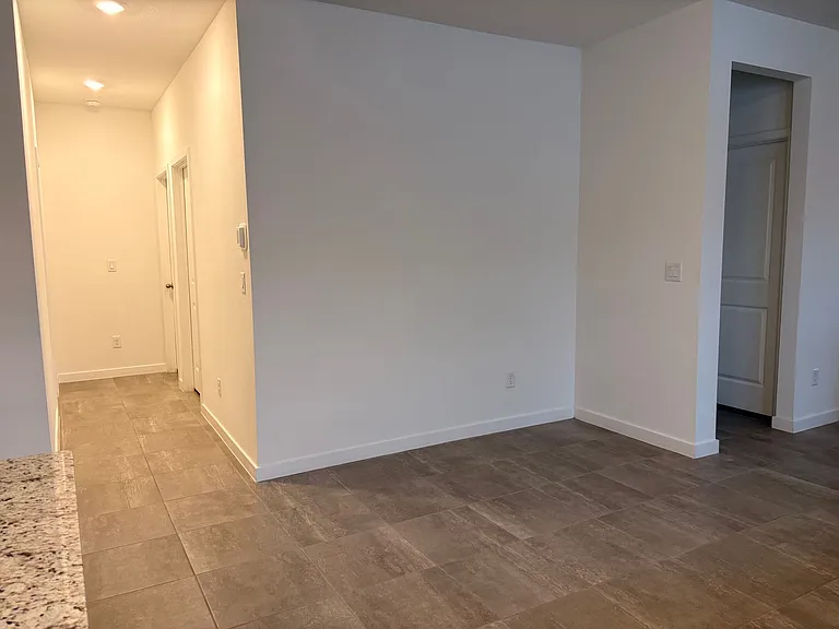 Guest bedroom and bathroom hallway (Left) /master bedroom door (Right).