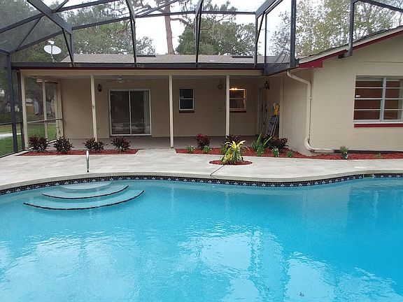 house and lanai from pool