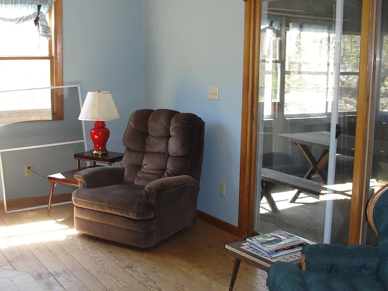 Living Room with sliding door to screened porch.
