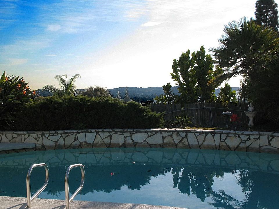 Sparkling Pool, City Lights View