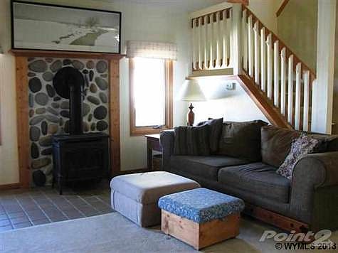Stairs lead up to 3 bedrooms and a bath.