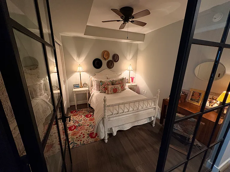 Second bedroom, complete with closet with Elfa shelves and ceiling fan.