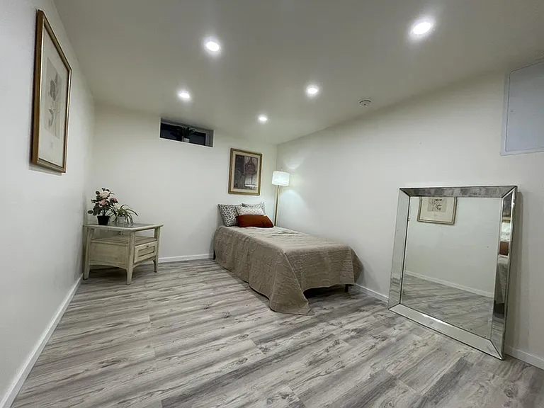 Modern recessed lighting creates the perfect ambiance for reading, relaxing, or unwinding after a long day.
