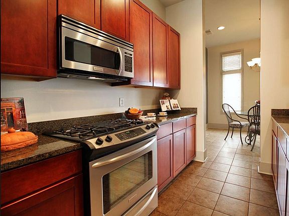 Main Floor: Kitchen featuring stainless steel gas oven.