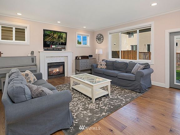 Wide-plank Hickory hardwoods throughout the main floor