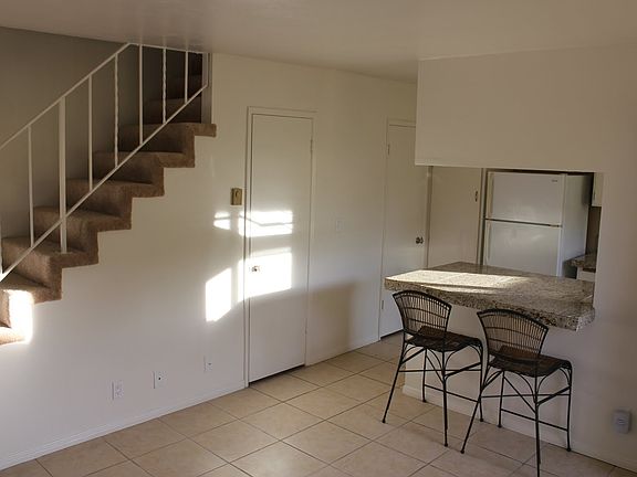 Garage entrance through door on left. 1/2 bathroom in door to the right. Updated with stainless steel refrigerator.
