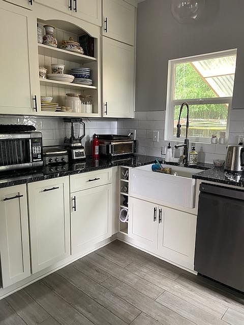All new cabinets, granite countertop, farm sink and dishwasher