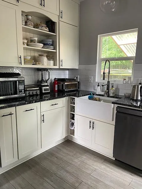 All new cabinets, granite countertop, farm sink and dishwasher