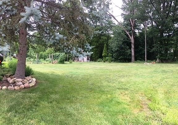 Some of the level back yard.  Note there is a playhouse for the kids (electricity runs to it, but not connected).  Also a fenced