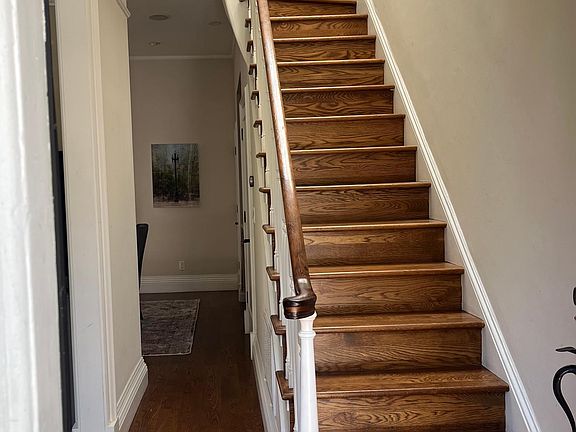 Stairway going up from front door to second floor