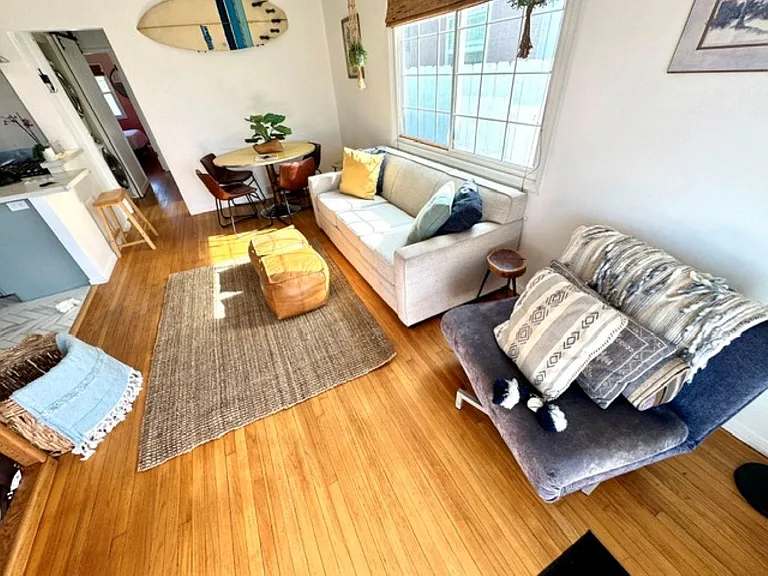 Original wood floors and comfortable seating make movie nights in your future