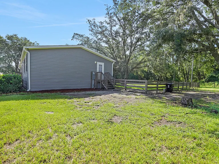 SIDE YARD & FENCED BACK YARD VIEW