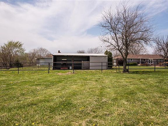Open space in the barn and pipe fencing for horses.  There is also a smoker in the barn used by this seller for smoking deer meat.  The pasture has 3 ponds stocked with lots of fish.