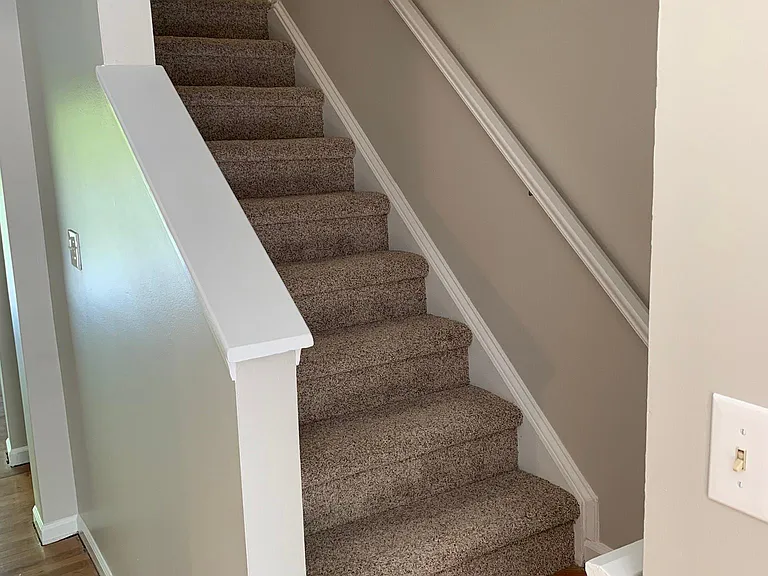 Good example of color schemes: AGREEABLE GREY walls, new carpet, high-gloss white, distressed barn-wood hardwood floors