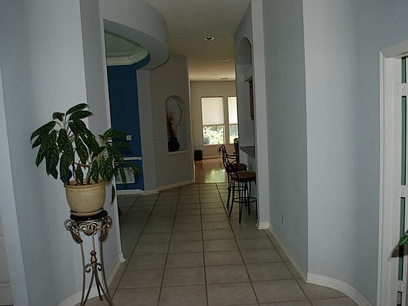The entry features tile flooring.