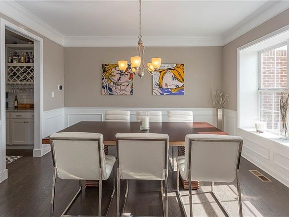 Formal dining room.  Notice the butler's pantry to the left, and all the extra trim detail, and crown molding.