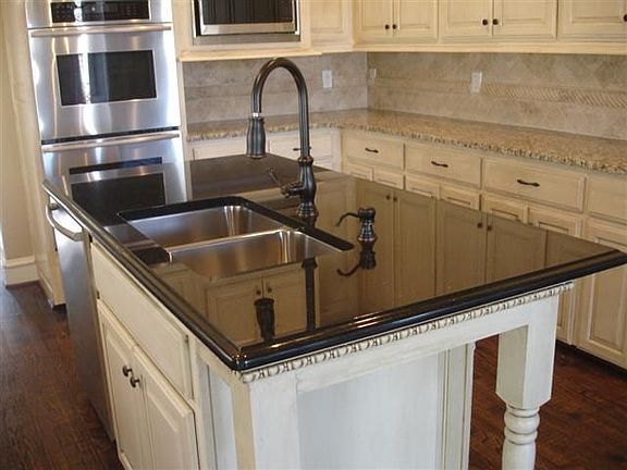 Huge island in kitchen with all top-of-the-line stainless appliances