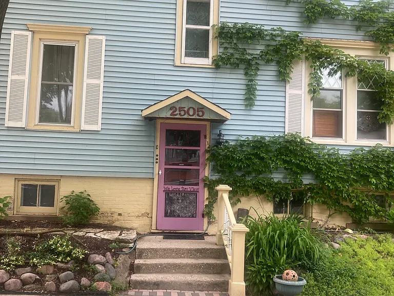 side of house on Bennett Avenue , entrance to apartments.