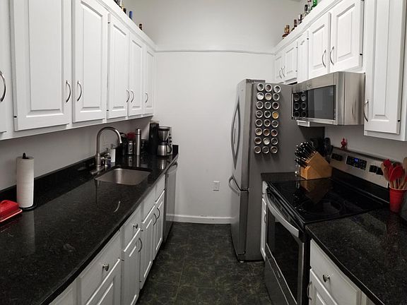 New granite counter tops and stainless steel Whirlpool appliances installed in August. Double-door refrigerator with filtered water. Garbage disposal and over-the-counter microwave.
