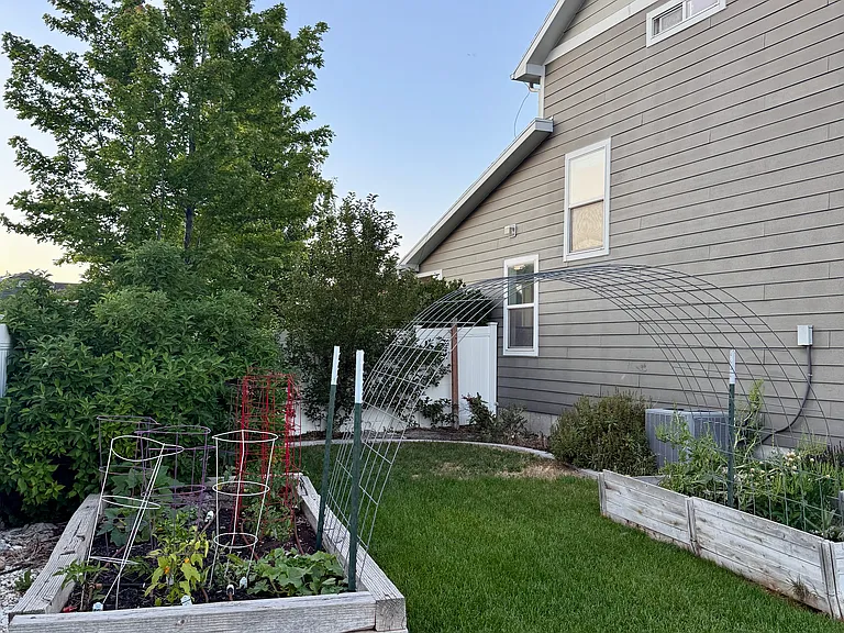 The home has 2 garden beds within the yard interior and 5 additional raised beds on county land.