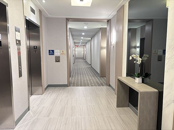 Elevators and hallway to unit
