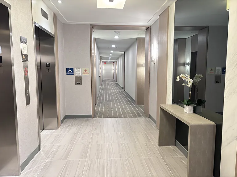 Elevators and hallway to unit