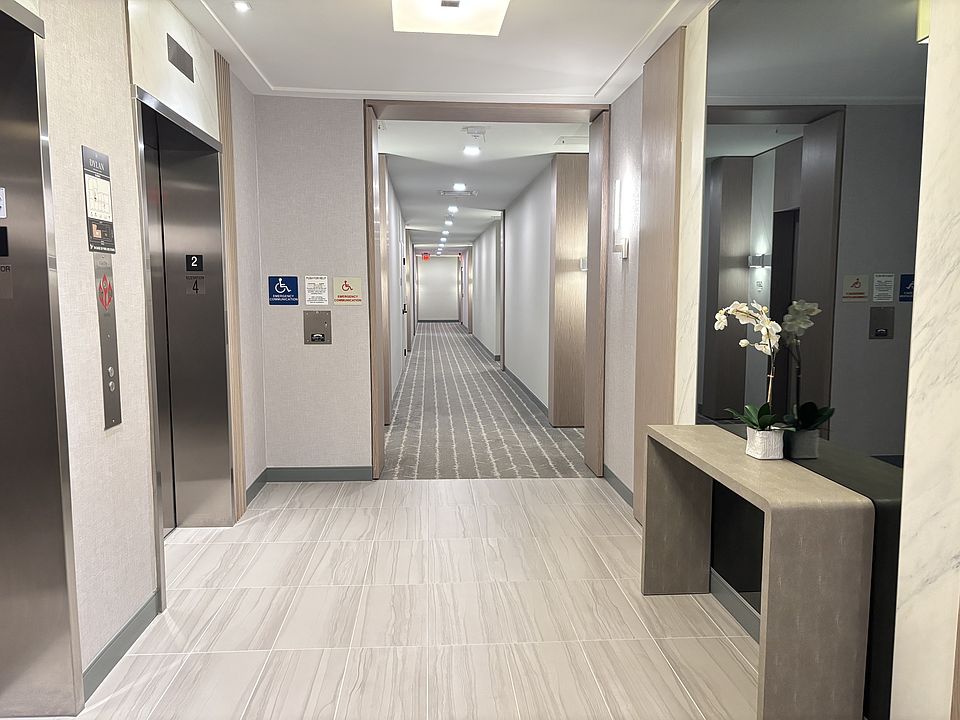 Elevators and hallway to unit