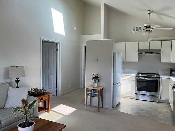 Kitchen with Newer Counters and Sink, Stove, Dishwasher and Refrigerator.