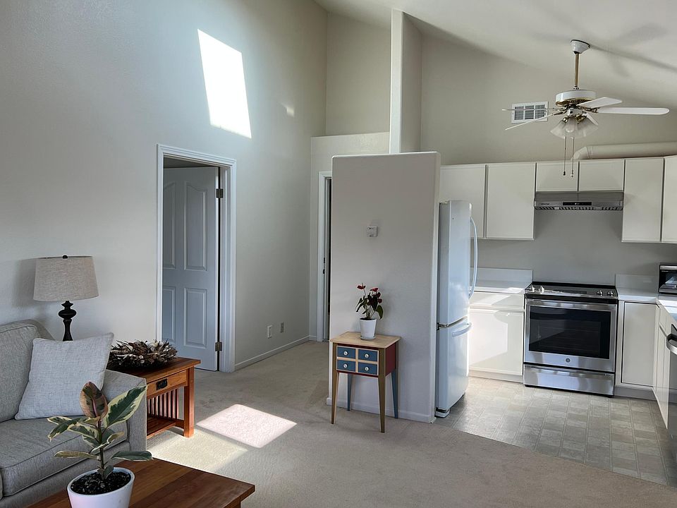 Kitchen with Newer Counters and Sink, Stove, Dishwasher and Refrigerator.
