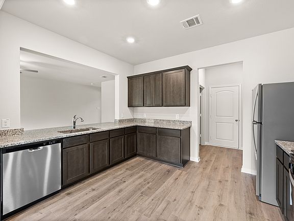 The kitchen of the Rayburn has sprawling granite countertops.