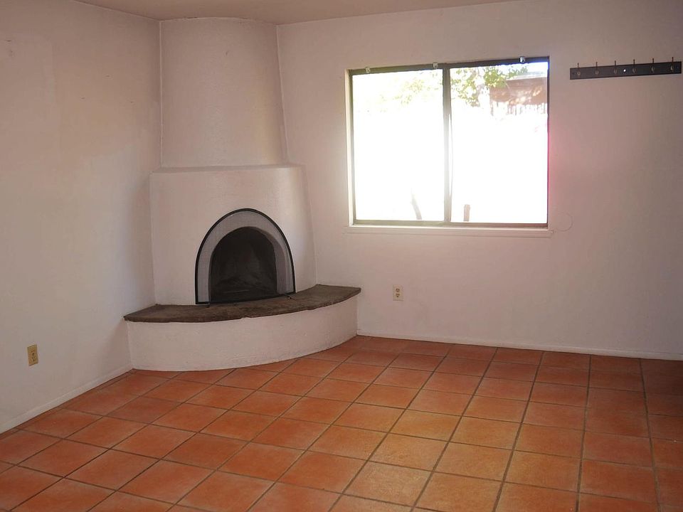 Living room with kiva fireplace