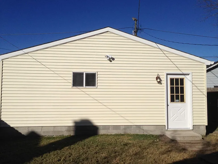 Huge modern 2 car plus garage with power doors.