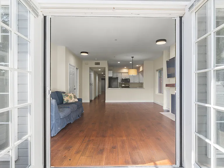 French doors connect indoors with the outdoor patio area